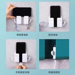 携帯電話充電台のベッドの棚の壁面に穴を開けずに壁掛け充電器スタンドの収納ケースを貼り付けて棚を置く