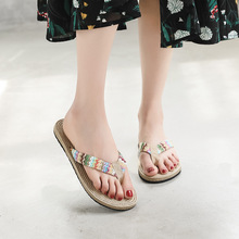 2022海边仿草编PP草编织人字拖女夏季时尚外穿平底沙滩夹脚凉拖鞋