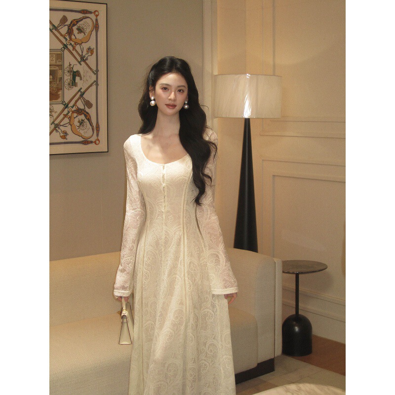 From a moment, a [Paisley] wool lace knit dress with a square neckline, slightly flared sleeves, and a slim, figure-flattering long dress