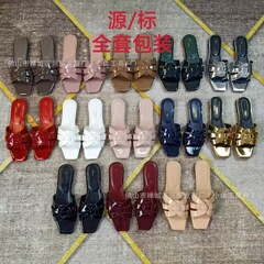 聖家欧米の外国貿易のファッション的なレジャーの平底のスリッパは1字のスリッパの女性の靴の外国貿易の純原の決まりを編みます。