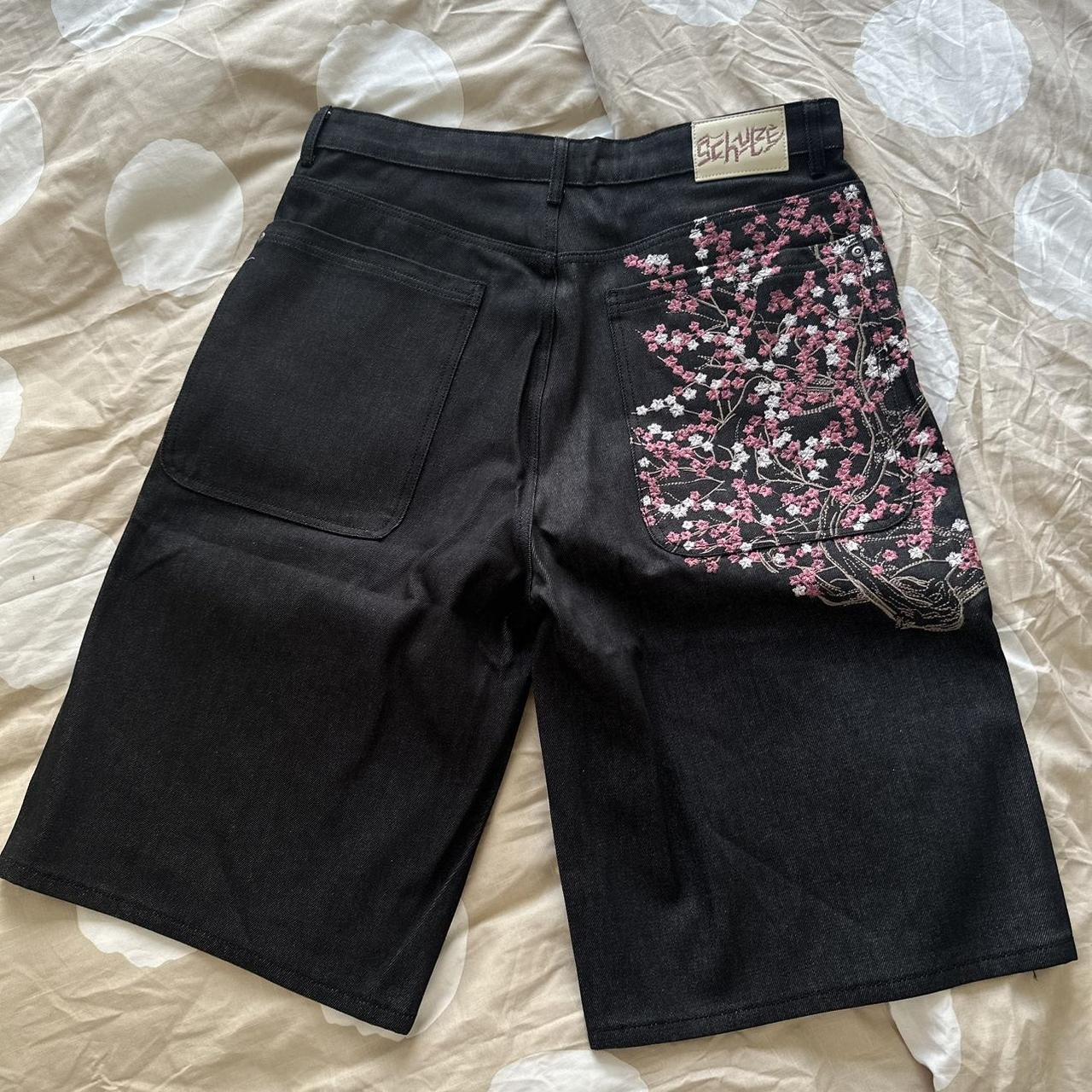 Derschutze pantalones de pierna recta con bordado de ciruela retro europeo y americano para hombres y mujeres, jeans de moda callejera de personalidad de todo fósforo transfronterizos