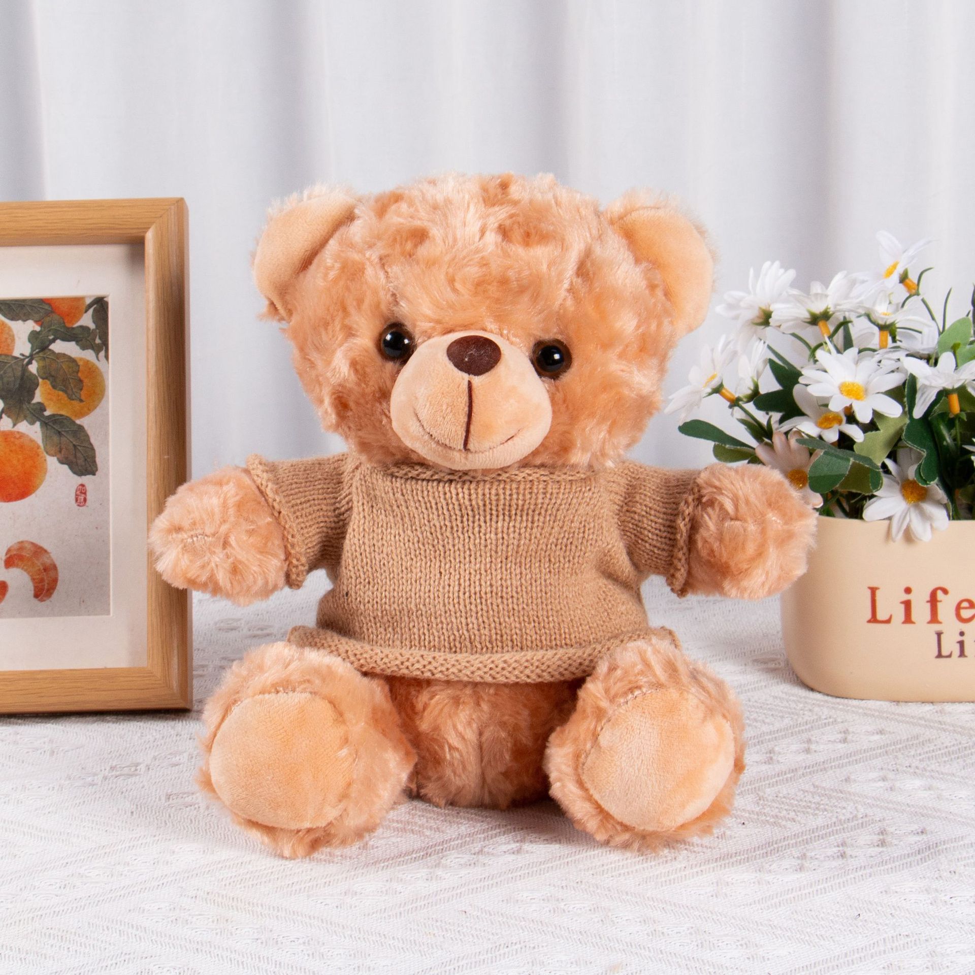 El oso marrón suéter marrón