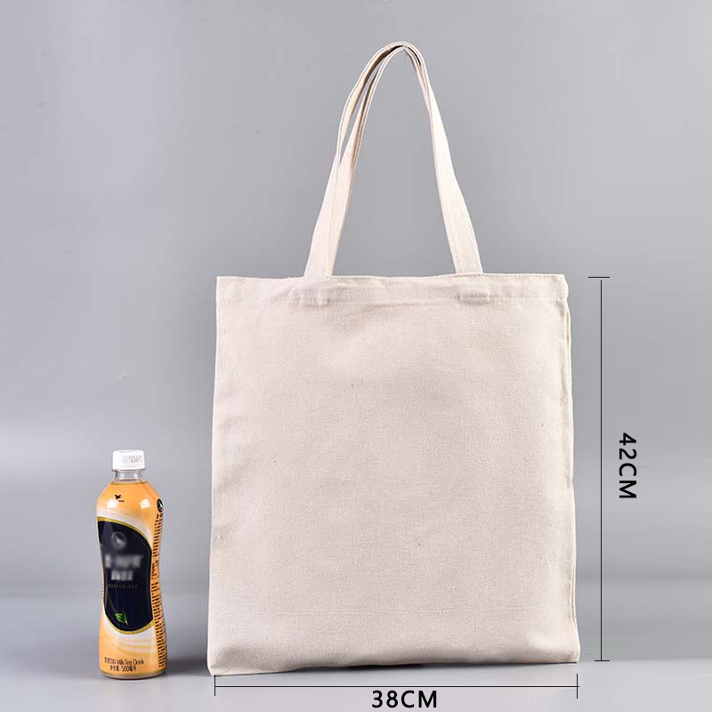 En stock bolsa de lona portátil en blanco personalizable logotipo de impresión en color de un solo hombro bolsa de compras bolsa de algodón de entrenamiento publicitario