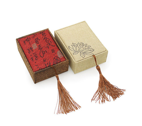 Packaged gift box for six rose quartz jewelry, with colored bow and black and white storage box for accessories