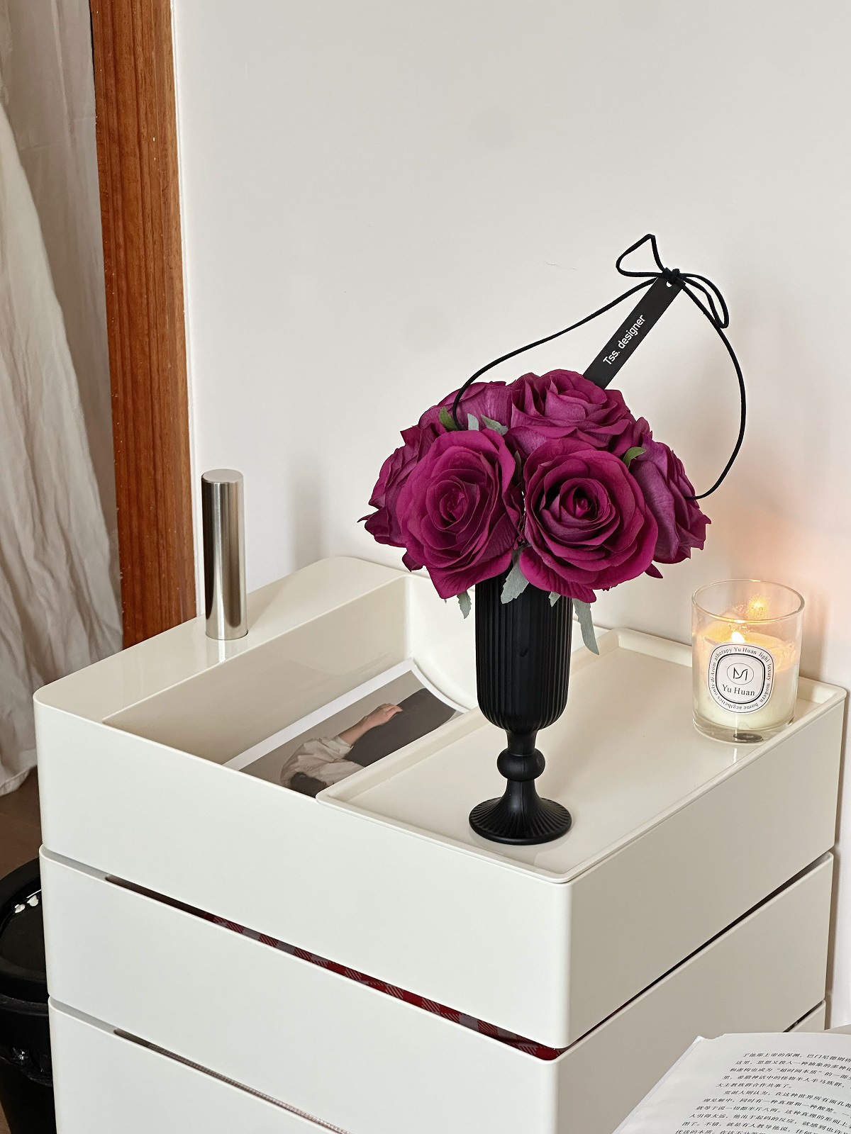 Purple red hand holding + tall vase