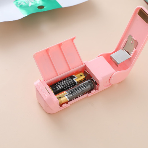 Portable mini sealing machine creative household food plastic bag opening sealing machine travel hand pressure heat sealing machine