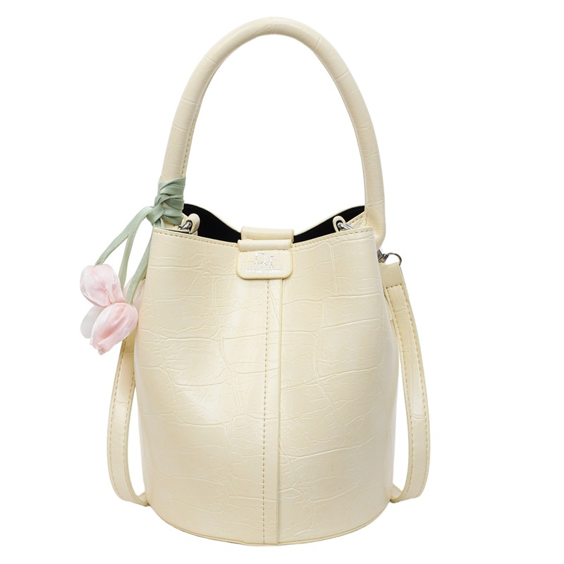 Bolso de cubo de jardín de verano 2025 nuevo bolso de mano estilo extranjero bolso de hombro con patrón de piedra pequeño bolso de mensajero fresco para mujer