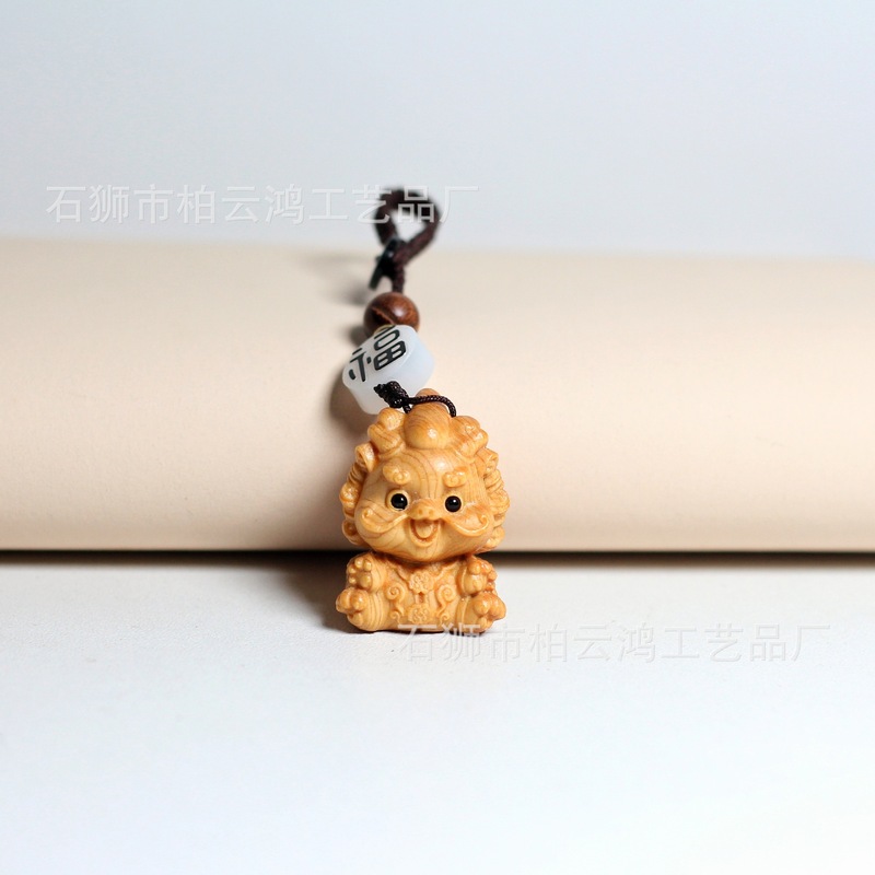 Thuja wood carving Jiuhua mountain listening key chain pendant cute animal travel creative mobile phone chain pendant wholesale