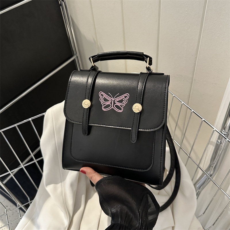 Estilo británico estilo coreano diseño de nicho ins hombro mochila bolso de las mujeres bolsa de cubo estilo universitario 2023 nueva bolsa de mensajero