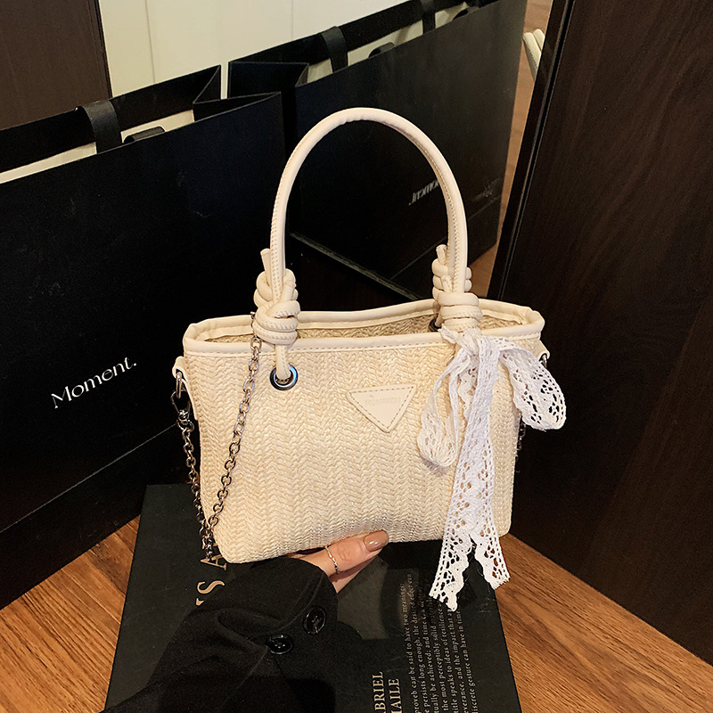 Bolsa de tela retro 2025, bolso de mano de paja de gran capacidad, nueva moda europea y americana, bolso de hombro empalmado