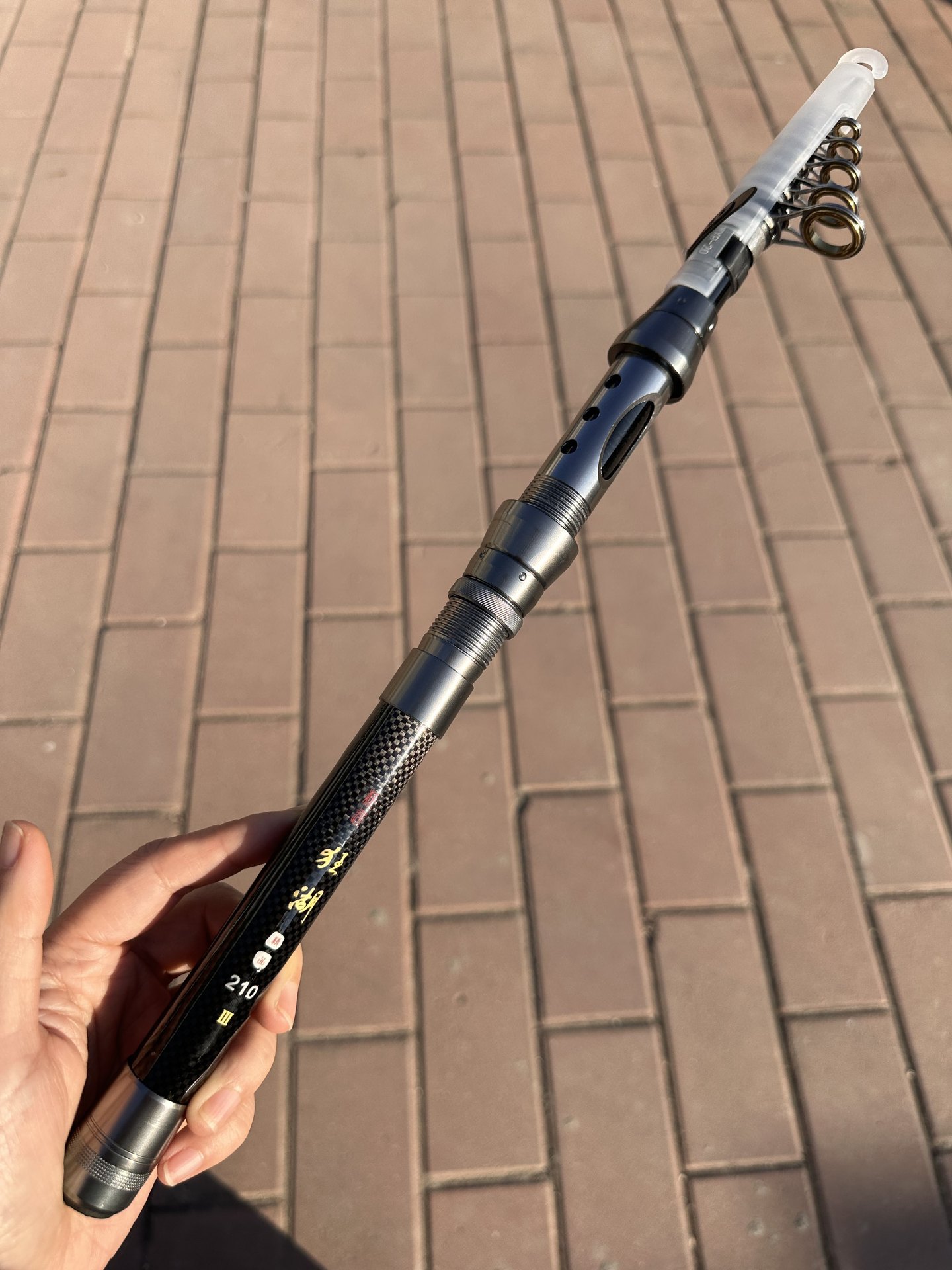 Oro negro carbono retráctil portátil varilla de mar de ajuste duro varilla de caña de pesca retráctil cadena de suministro fábrica de suministro al por mayor