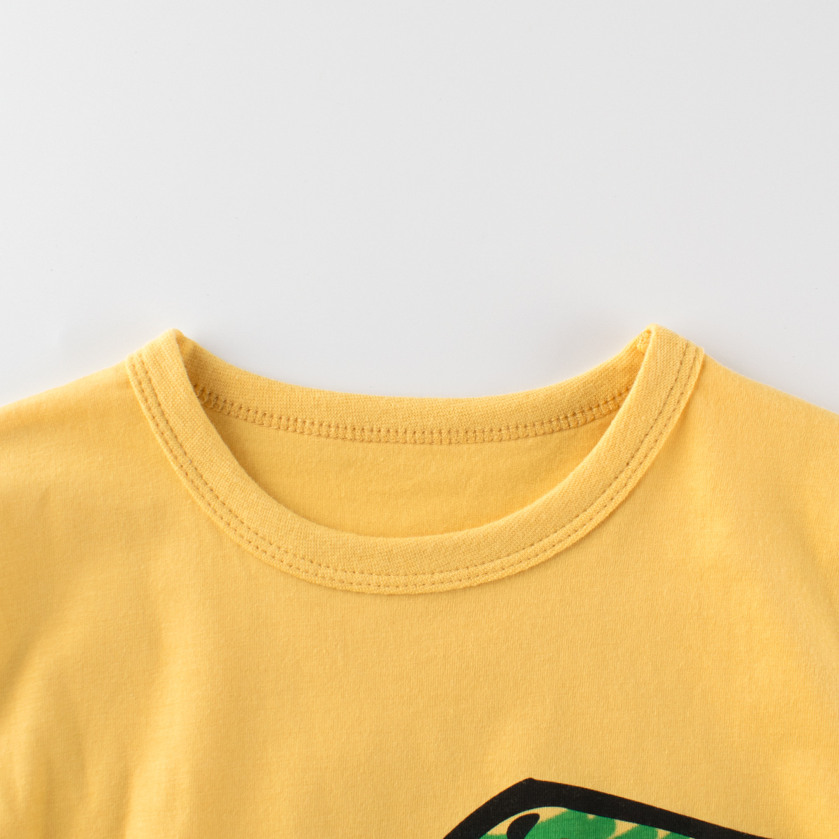 27kids ropa para niños 2025 verano nuevo estilo para niños camisa de fondo de manga corta para niños camiseta de dibujos animados de dinosaurio