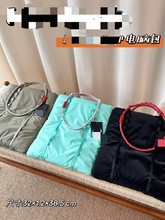 新款户外山系托特羽绒包正单肩斜挎挂绳扣斜背运动包男女同款