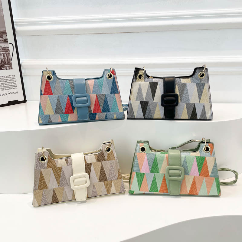 Nicho de diseño geométrico empalme brazalete bolso de hombro para mujeres 2025 primavera nueva textura bolso de hombro