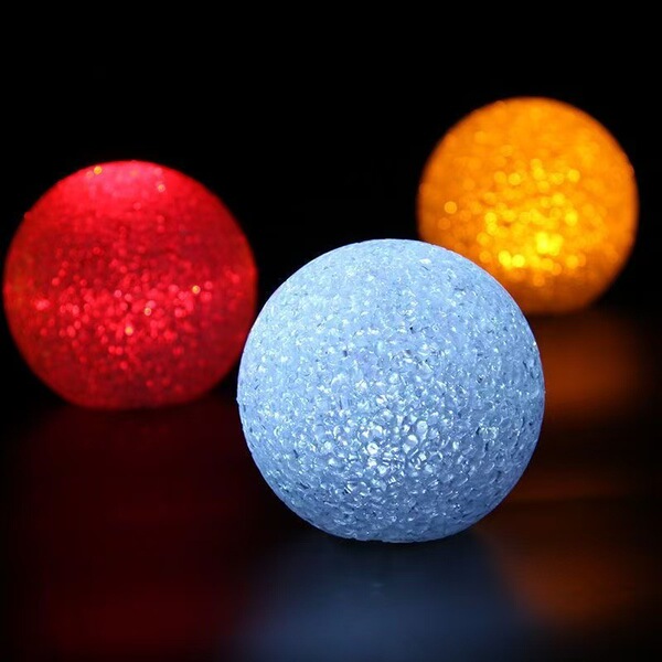 Holding a luminous ball lamp for dance chorus