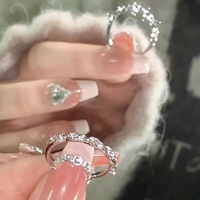 925 Silver plating wrapped in love river crushed diamond ring female niche light luxury light luxury INS wind burst glitter ring twist open jewelry