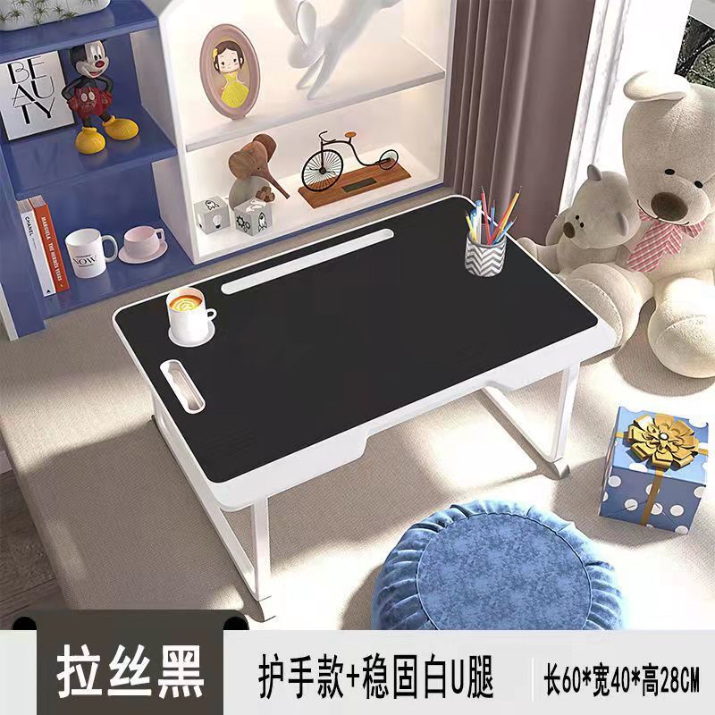 ベッドの上のノートパソコンの机の学生寮は小さいテーブルの部屋を畳むことができます。|undefined