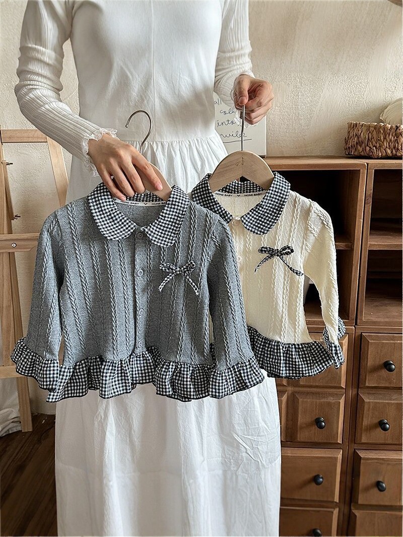 2026 primavera nueva camisa de cuello de muñeca de cuadrícula de mangas largas de encaje arco de camisa de estilo occidental para niños