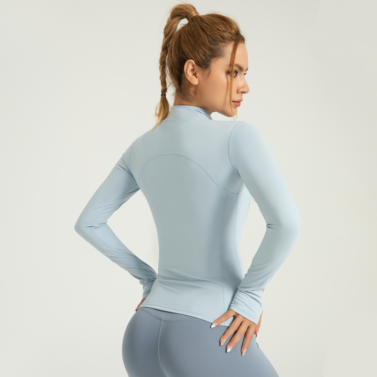 Zona transfronteriza Ropa de yoga desnuda Chaqueta deportiva Chaqueta ajustada de cuello alto de nailon delgado Chaqueta ajustada Ropa deportiva para correr