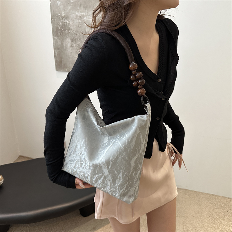 Nueva bolsa de estilo chino para mujeres 2024 verano nuevo estilo simple de moda seda bolso inferior nicho universal bolso de hombro casual