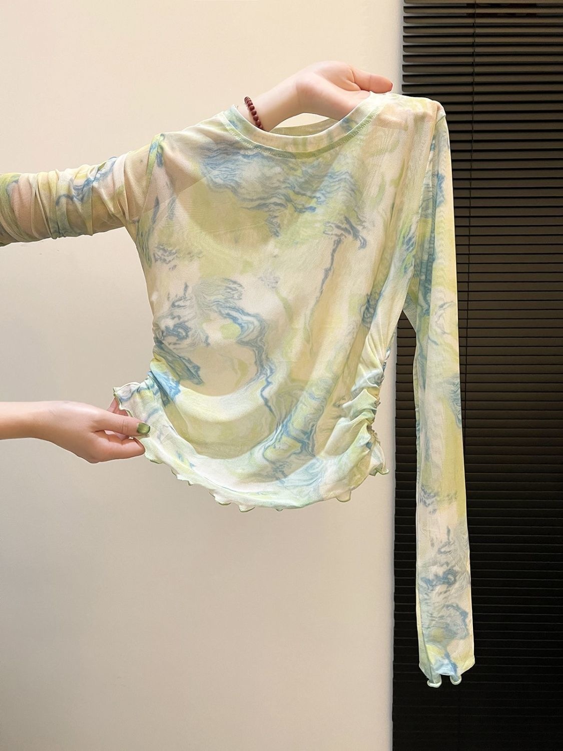 Fresh and elegant green tie-dye mesh top for women, perfect for summer 2026. Features a pleated, slimming, and sun-protective design.