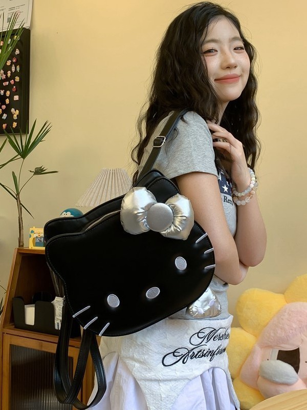 アニメのかわいい蝶結びの子猫の定型的なリュックサック2025の新型の個性は街の少女の心のリュックサックのプレゼントを出します。|undefined