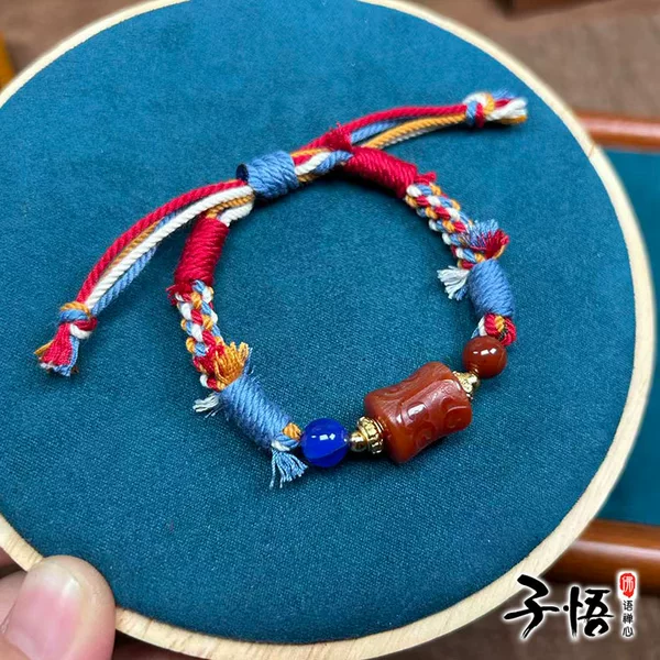 Original design red agate bamboo knot bracelet with intricate carving, Xizang-style hand-woven wristband, Chinese New Year red cord