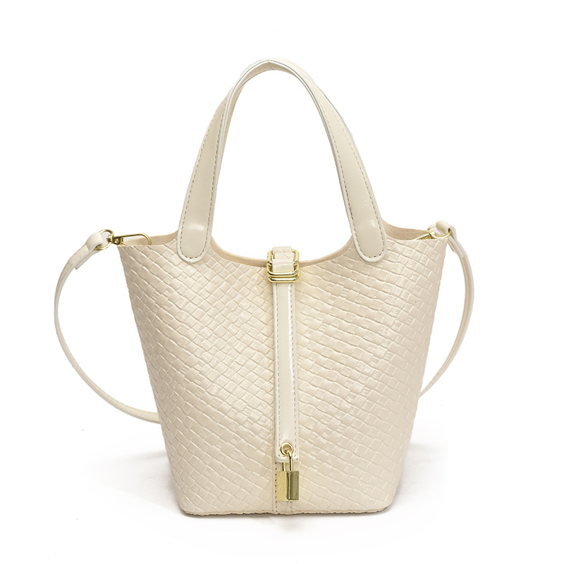 Bolso de cubo portátil con patrón tejido para mujer 2025 nuevo estilo coreano de lujo ligero de alta gama bolso de mensajero para niños de nicho