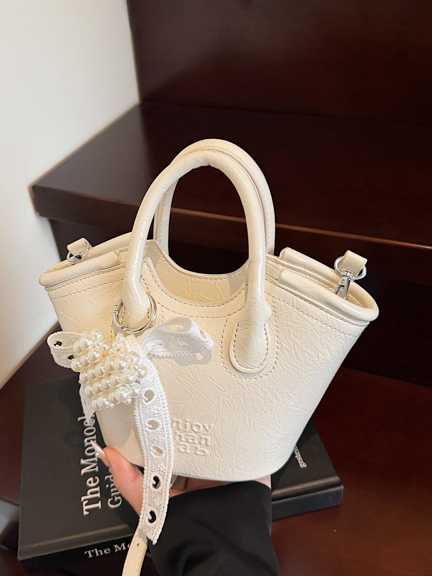 Bolso de cubo de mano de nicho de comercio exterior 2025 nuevo producto bolso de mensajero de moda casual de todo fósforo bolso de hombro de viaje de trabajo de moda