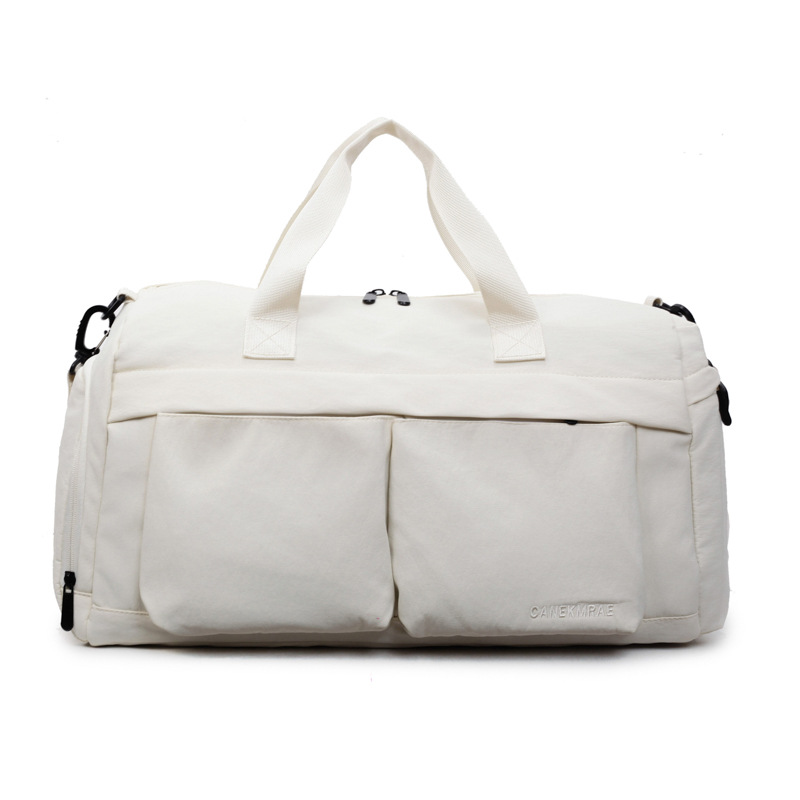 Nueva bolsa de viaje portátil simple y versátil, bolsa de equipaje de gran capacidad para mujeres, bolsa deportiva leve y casual de alta calidad.