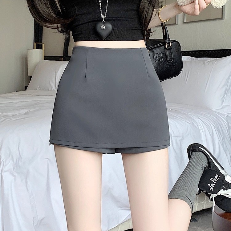 Vesta de busto negro de primavera y otoño de verano de mujeres, un diseño de pantalón con una falsa abertura de pantalón de cintura alta, una falda corta de cadera