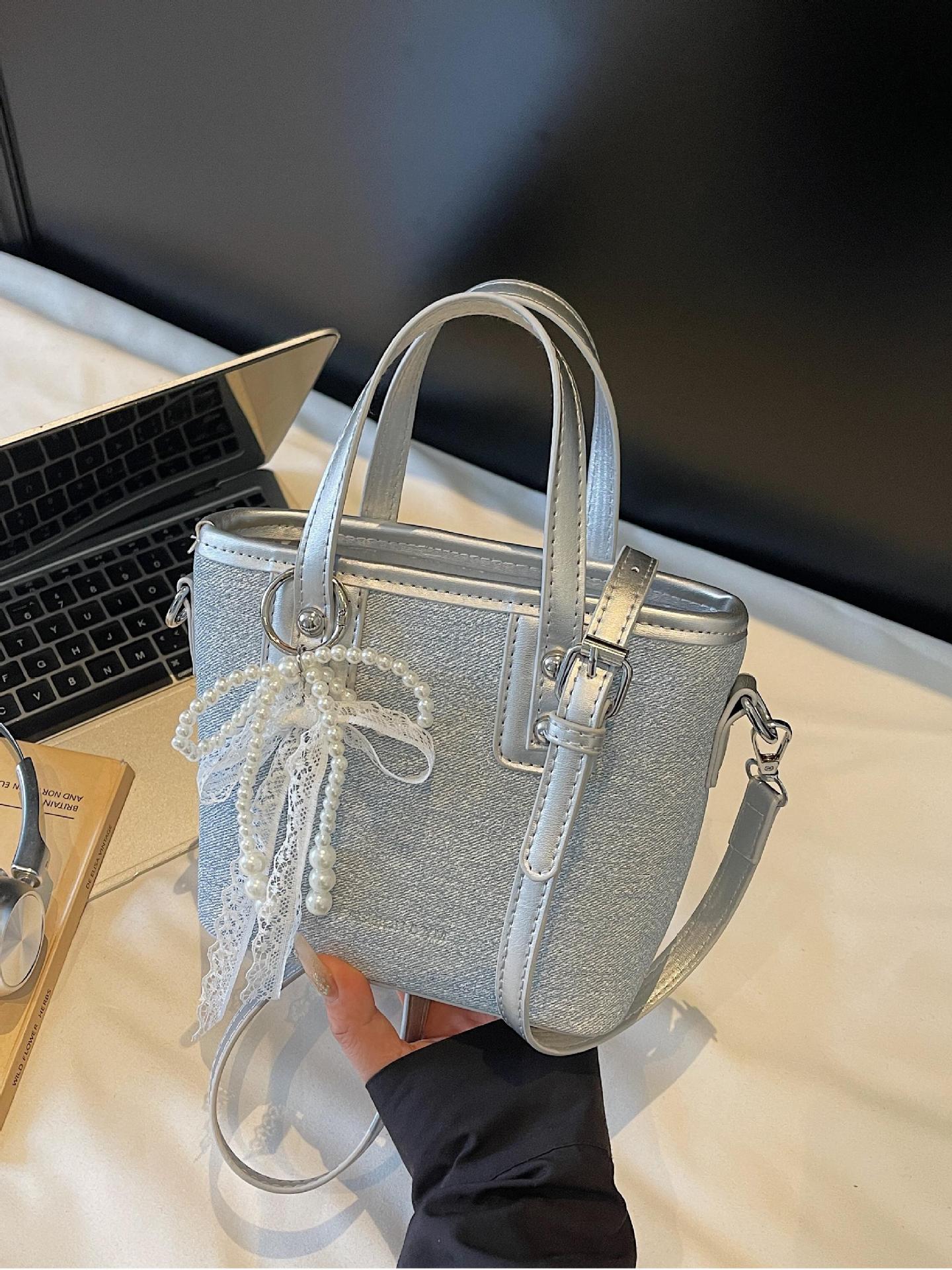 Bolso de cubo de mano de estilo occidental de moda para mujer 2025 nuevo bolso de hombro de todo fósforo de color de contraste bolso de mensajero de viaje de textura de moda
