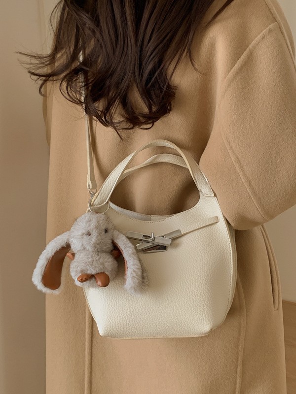 Bolso de mujer nuevo estilo coreano nicho de moda lichi bolso de cubo portátil de alta sensación de ocio mochila de viaje