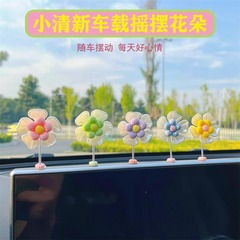 首を横に振って花を飾る車の置物車の中で台の装飾の置物のかわいい系の清新な首を横に振って花を飾る置物