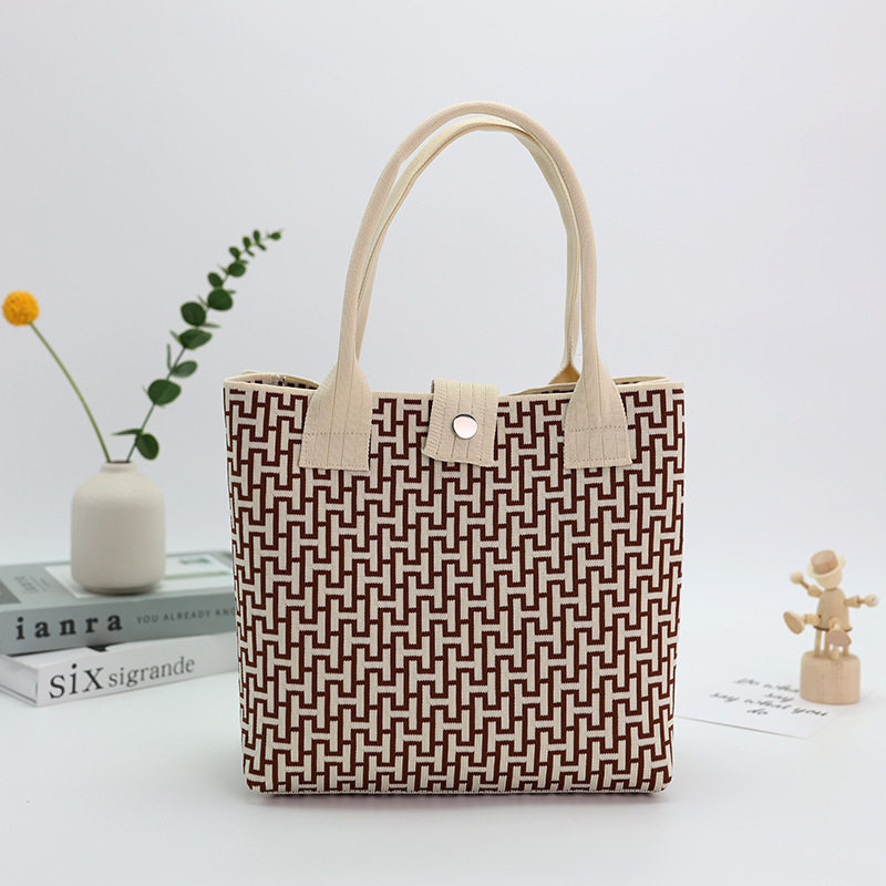 Japón y Corea del Sur tejido bolsas de mano bolsas de viaje de gran capacidad bolsas de compras de chicas fabricantes de bolsas H al por mayor