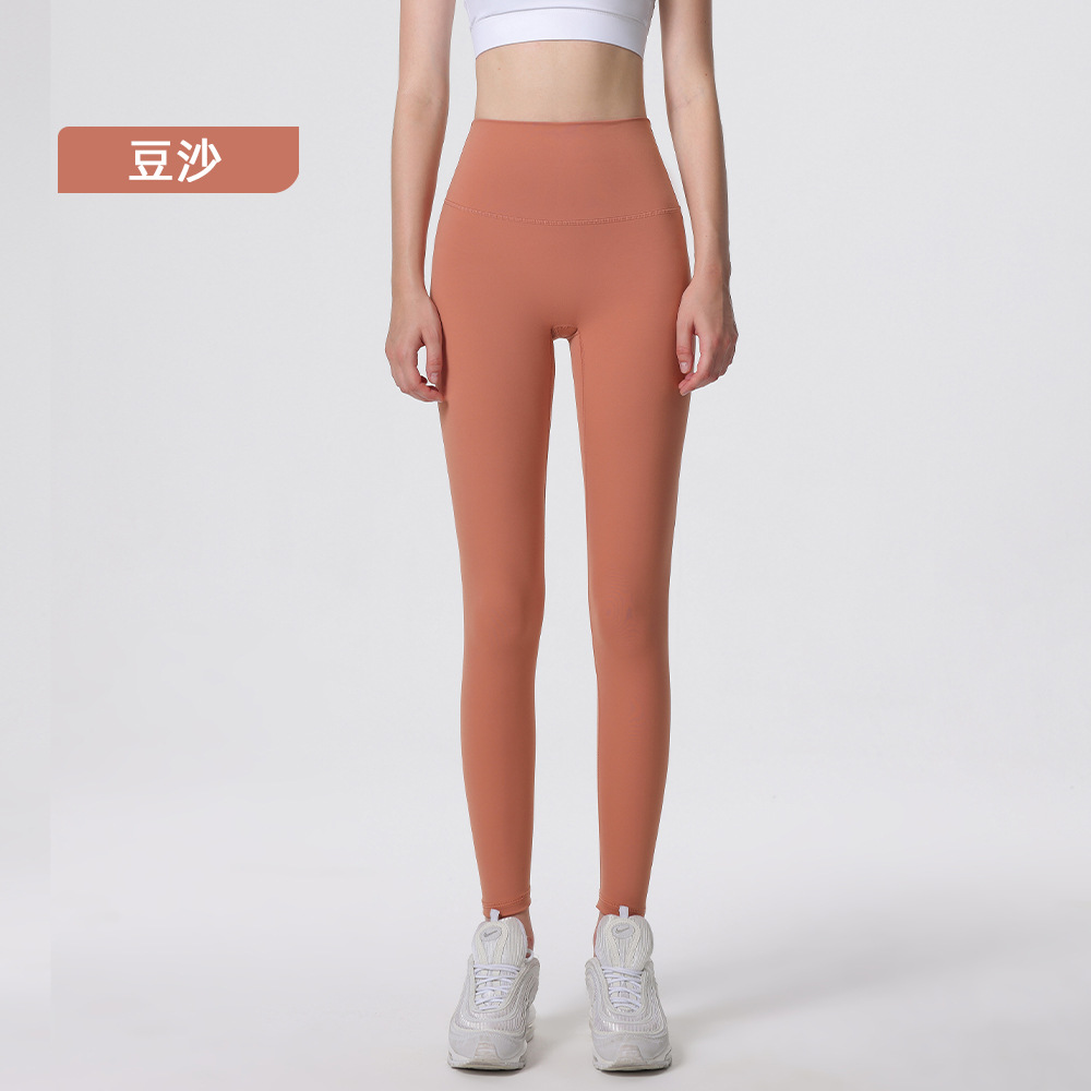 Nuevos deportes de yoga cintura alta desnuda sensación de no vergüenza línea piel-friendly levantamiento de la cadera del vientre que no se contrae la caída de la aptitud de las mujeres pantalones recortados