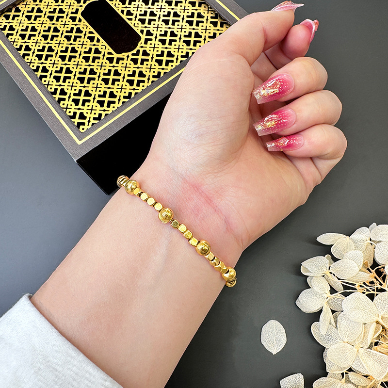 Nueva pulsera de oro de arena de moda femenina, estilo de alta sensación simple y popular, joyas de mano no se desvanecen al por mayor.