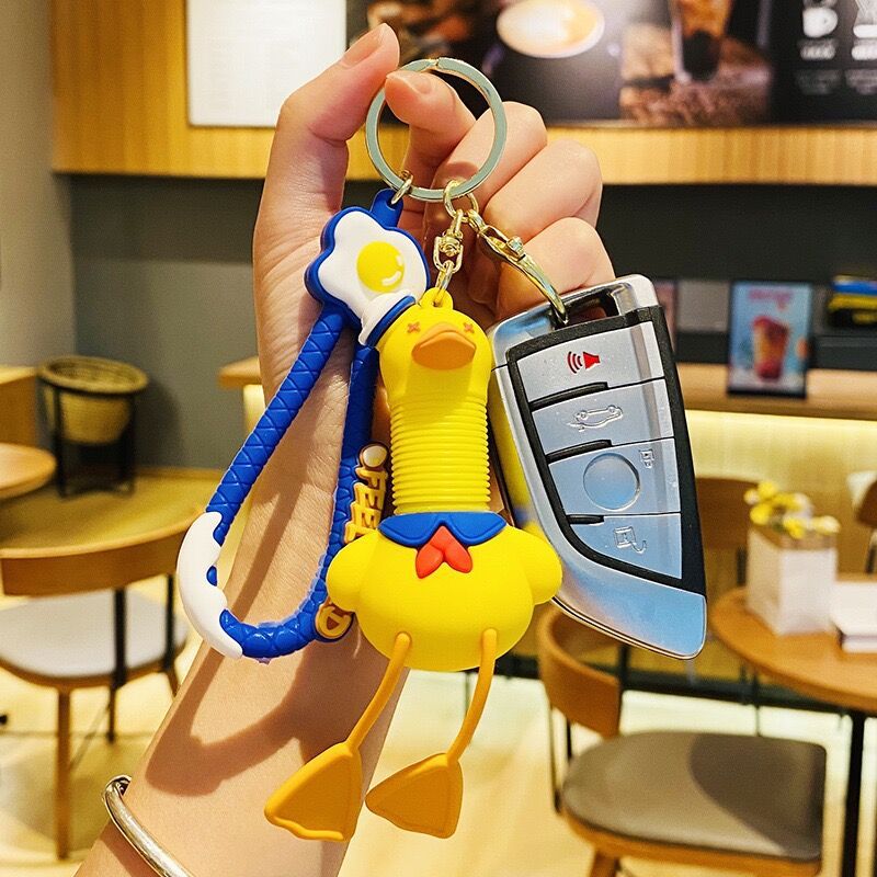 Llavero de cuello telescópico creativo de dibujos animados Divertido colgante de bolsa de descompresión colgante de coche cadena anillo pequeño regalo al por mayor