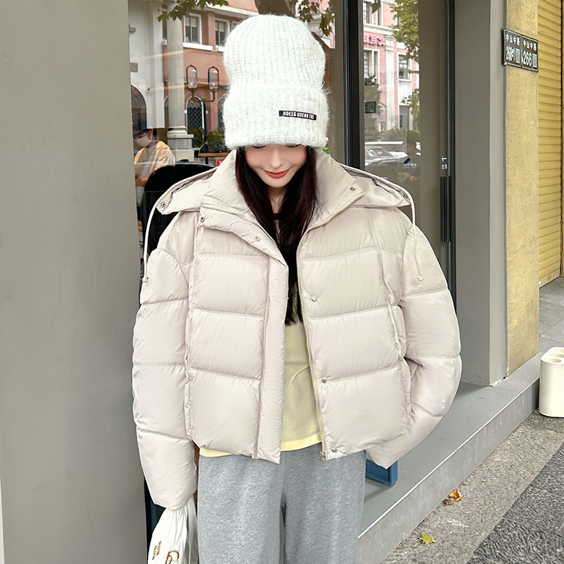 2025 nuevo encapuchado grueso corto de moda de algodón de invierno mujer pequeña chaqueta de algodón de pan caliente