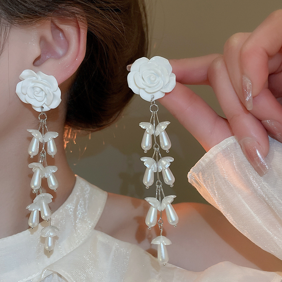 Pendientes de flor de lazo elegante de súper hada de plata Pendientes de moda de lujo ligero francés Pendientes de todo fósforo dulce de estilo literario