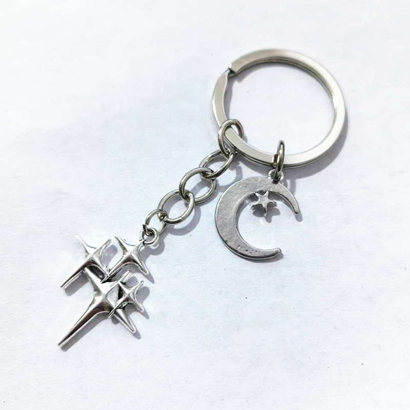 Moda nueva estrella de aleación hueco llavero adornos pareja hombres y mujeres bolsa colgante lindo mochila adornos