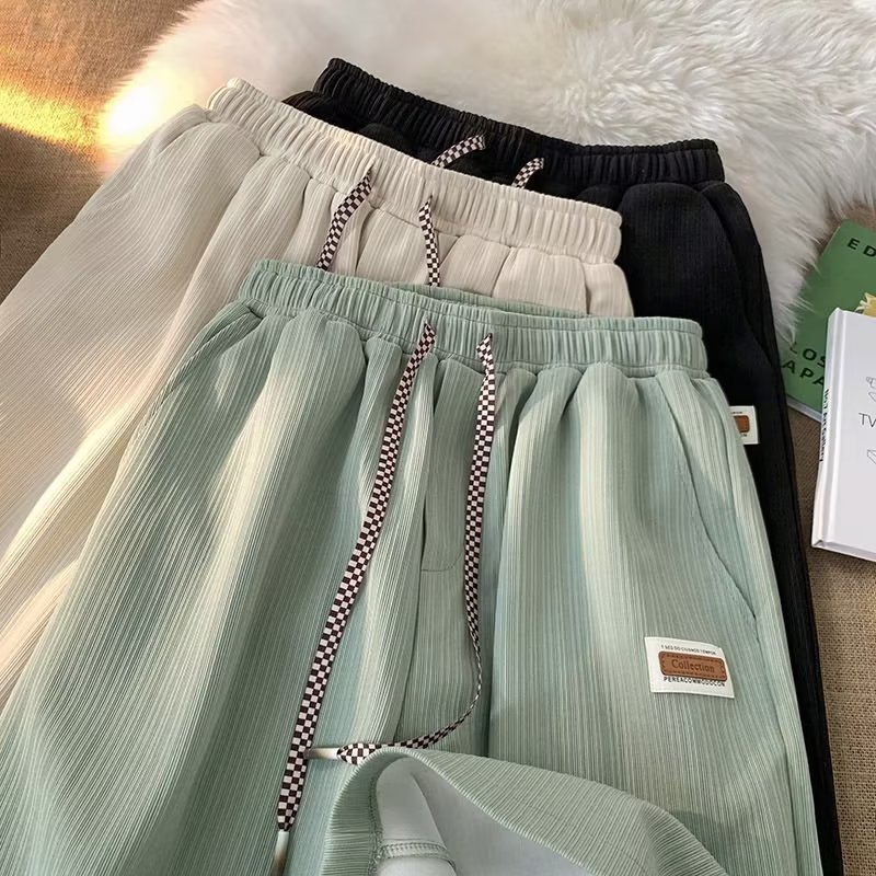 Pantalones casuales primavera y otoño Juventud Popular color sólido Pantalones deportivos moda marca quinta pantalones moda Harajuku suelta nuevos hombres