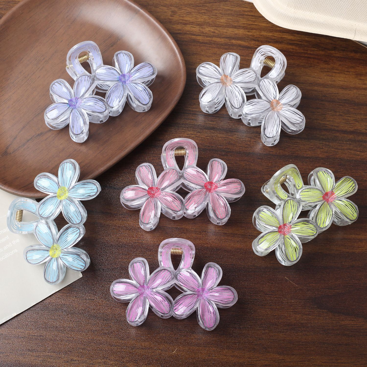 Clip de agarre de flor de frangipani de color caramelo caliente de Amazon transfronterizo Horquilla de flor de color transparente Horquilla de estilo de vacaciones de viaje