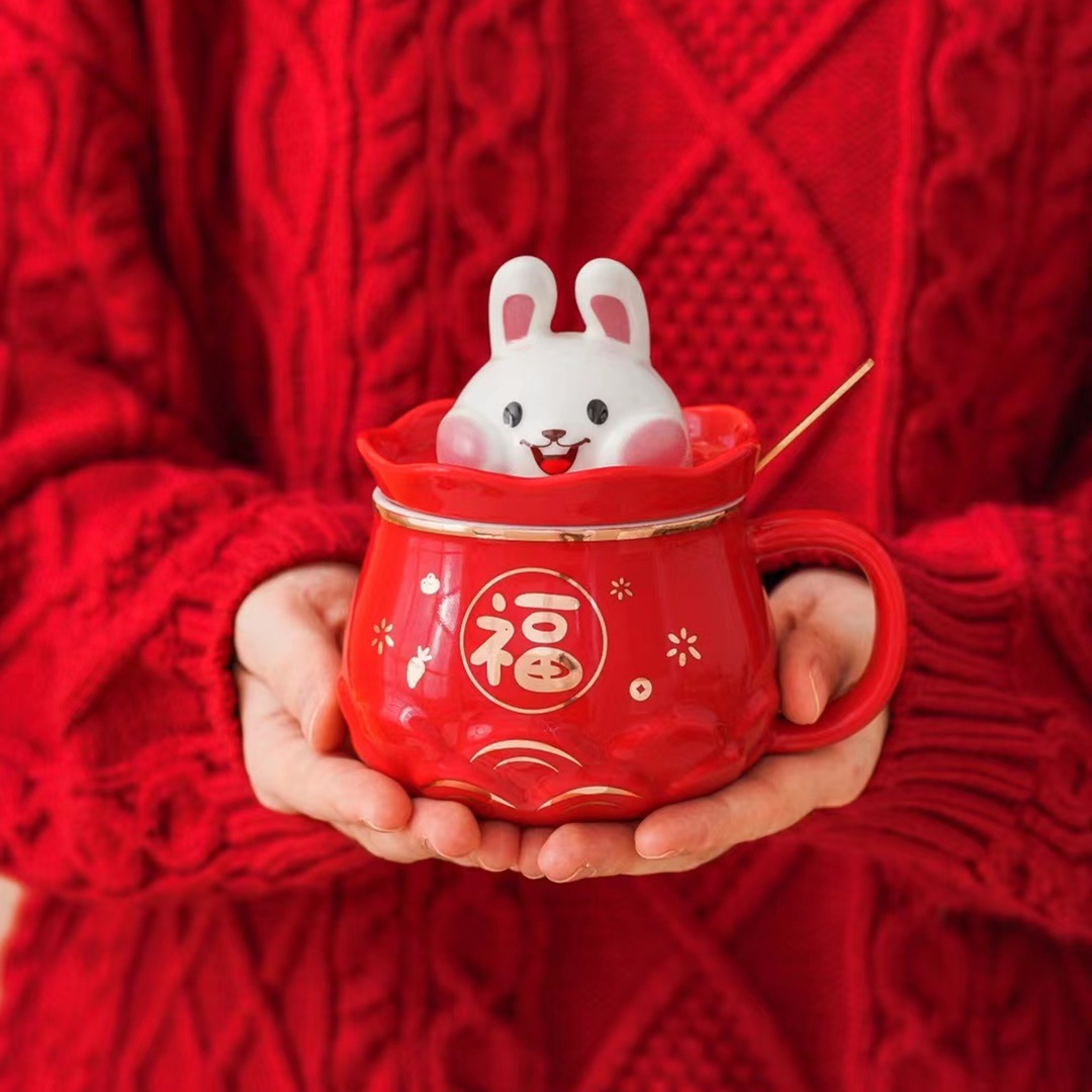 Suerte creativo Bolsa de Año Nuevo conejo taza regalo personalizado dibujos animados taza café cerámica con tapa cuchara agua lindo