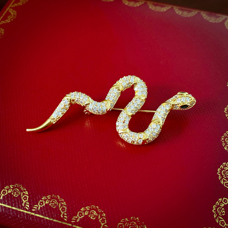 Europa y América exagerada circón broche en forma de serpiente de oro real galvanoplastia personalidad nicho temperamento alto sentido suéter pin ramillete femenino