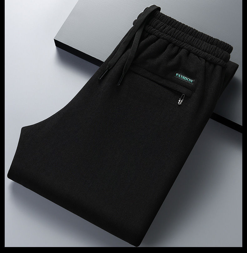 Pantalones casuales engrosados forrados de pana de invierno para hombres más tamaño Pantalones rectos de negocios de pana suelta