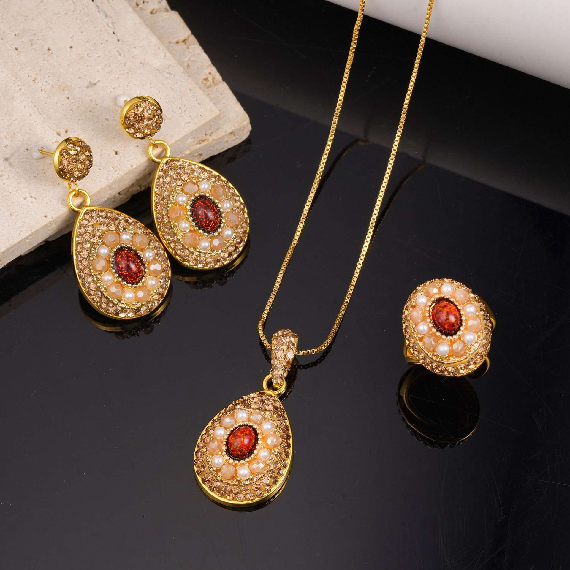 Cross-border vintage court-style jewelry set, including gold-plated teardrop red diamond earrings, a necklace, and a ring, perfect as bridal or banquet accessories
