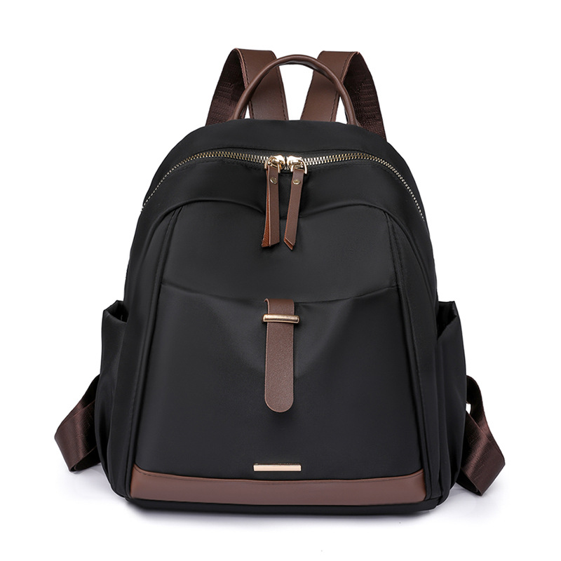 Fábrica al por mayor 2023 nueva mochila de nailon casual para mujer, mochila de viaje urbana simple de moda, mochila escolar