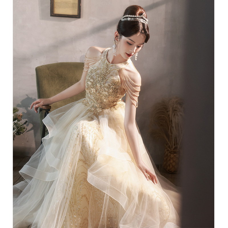 Vestido de noche de champagne temperamento de banquete de otoño anfitrión de alto nivel lujo nicho de gama alta vestido de examen de arte para adultos