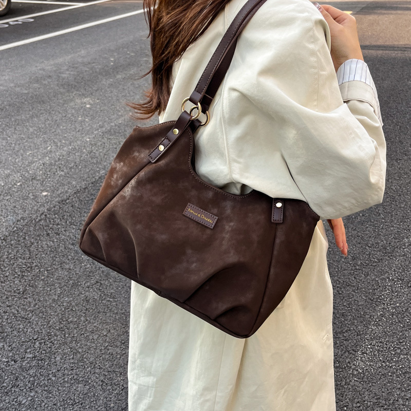 Bolsa de mano de peluche retro de gamuza para mujeres 2025 nueva moda versátil bolso de viaje tote bolso de hombro casual braza